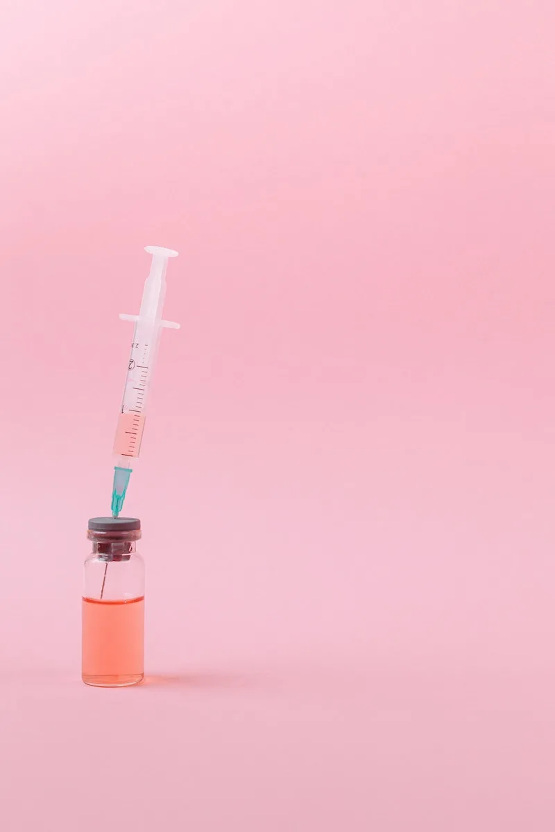 Covid Vaccine on Pink Surface